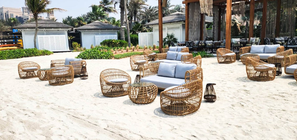 Beach lounge with white sand and Nest lounge furniture 