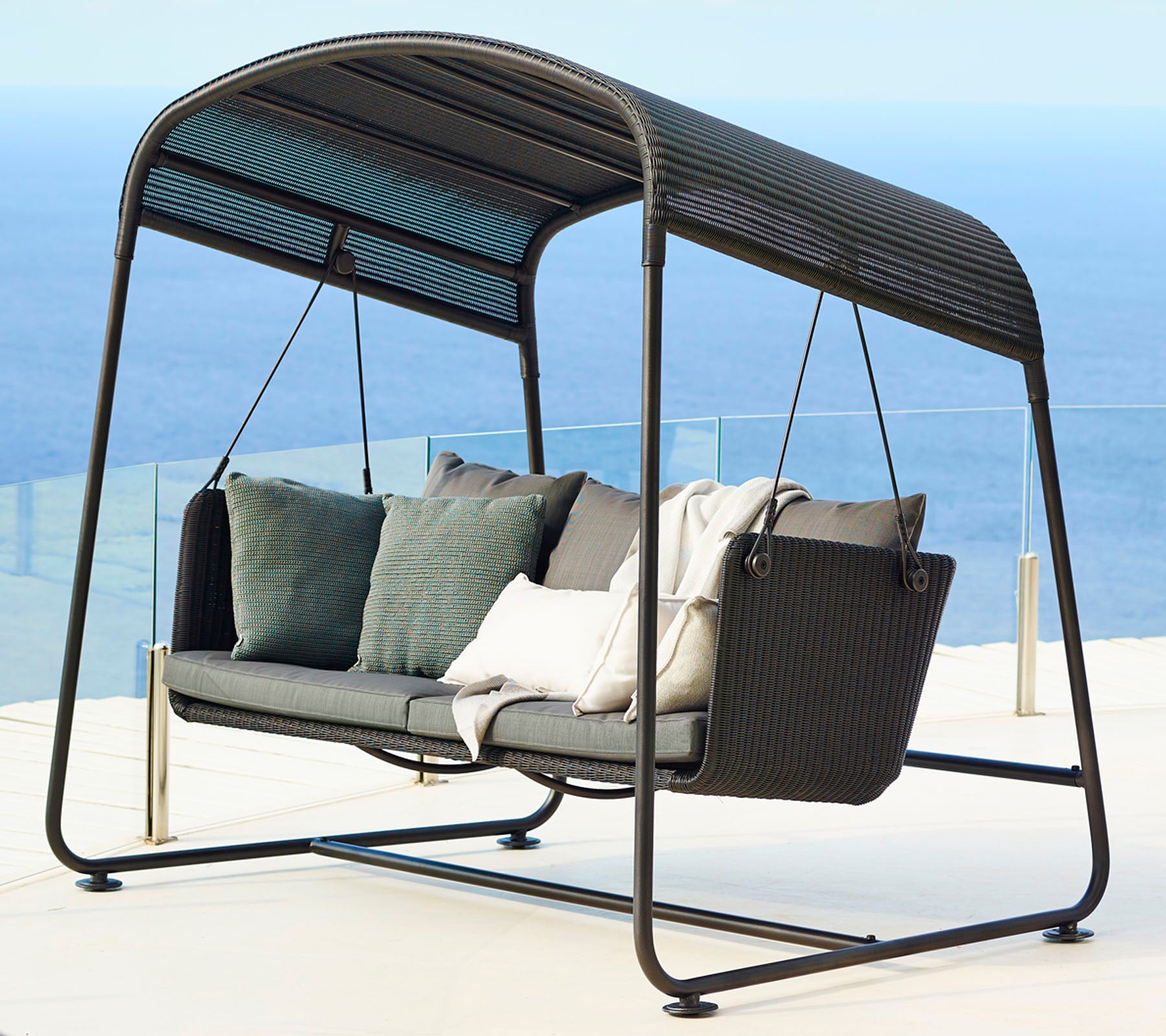 Stylish swing seat with a modern design, featuring plush cushions and a sleek frame, perfect for relaxation.