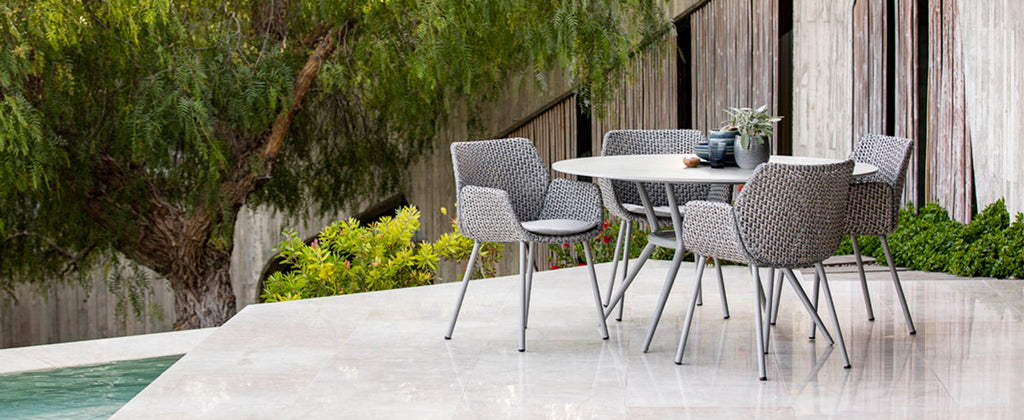 Modern outdoor dining chair with an elegant dining table