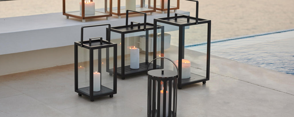 Decorative lanterns in various sizes with candles inside, creating an inviting ambiance.