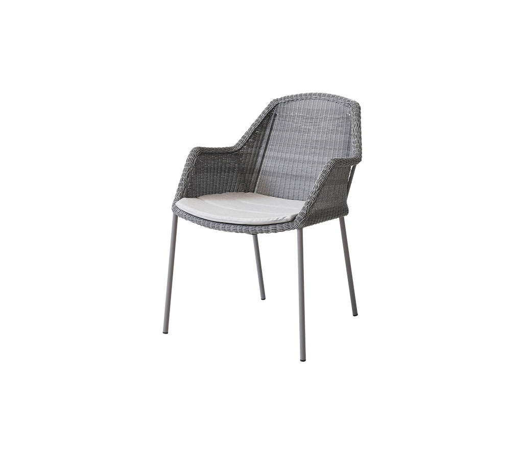 Stylish gray chair with a woven design and a light-colored cushion, perfect for adding comfort and elegance to any setting.