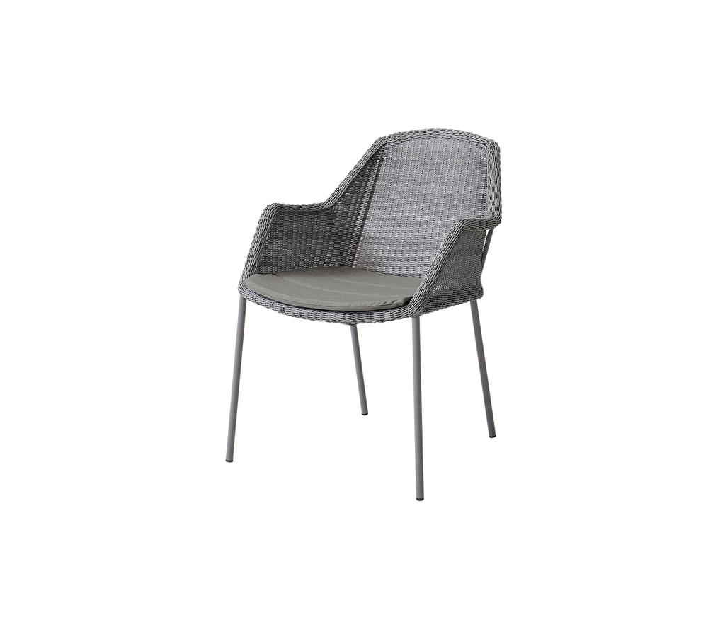 Gray woven chair with a simplistic design and sturdy legs, offering both comfort and style for casual seating.