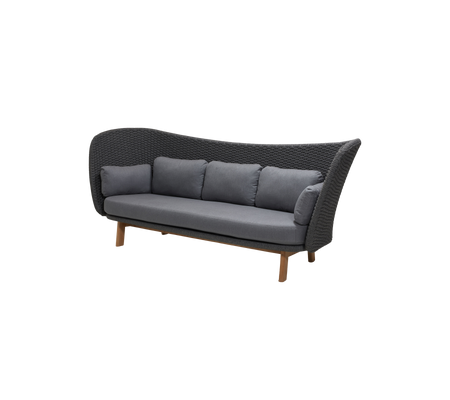 Stylish three-seat sofa with a woven design and plush gray cushions, supported by wooden legs for an inviting look.