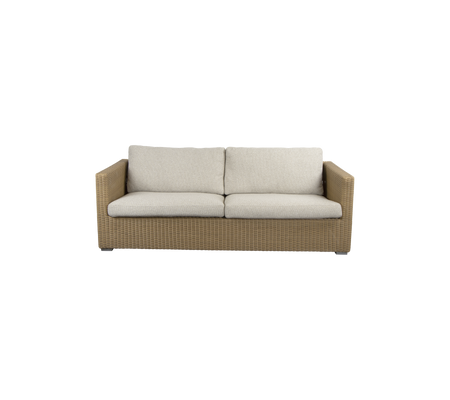 A stylish, two-seater sofa featuring a woven base and soft, neutral-colored cushions for comfort and modern design.