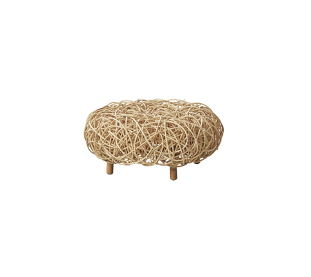 Natural woven ottoman with a rounded shape, supported by four wooden legs, adding a cozy and stylish touch to any space.