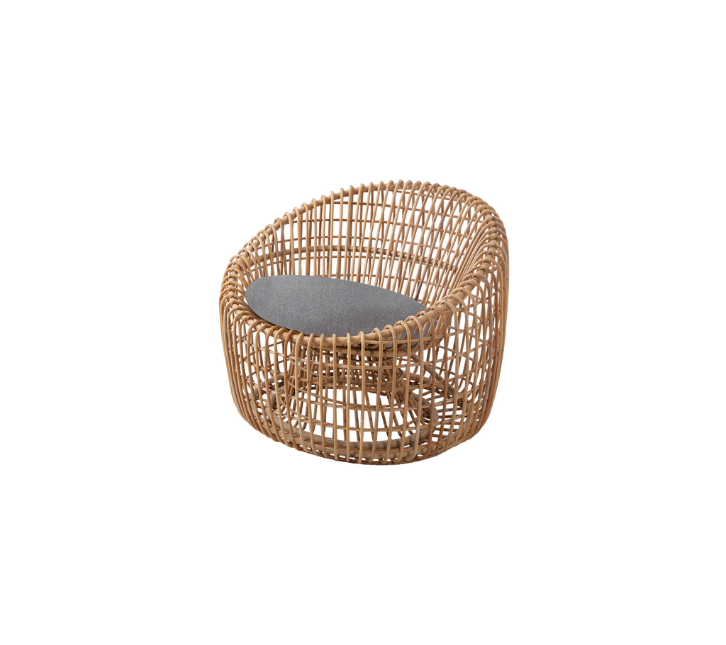 A round wicker chair featuring a cushioned seat for comfort, designed with a natural finish and a modern aesthetic.