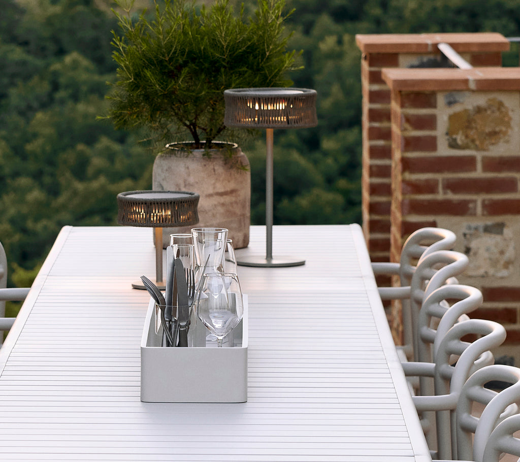 Aluminium club storage box on a table featuring Illusion lamps, a decorative vase, and glassware arranged neatly.
