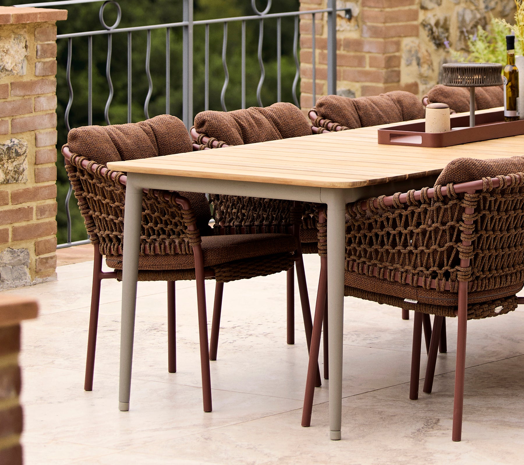 Umber brown Ocean dining chairs paired with a Core dining table, featuring a stylish natural finish and comfortable seating.