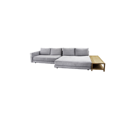 Stylish gray sectional sofa with plush cushions and a wooden side table, perfect for modern living spaces.